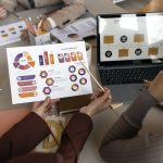 high-angle-people-working-with-laptop (1)